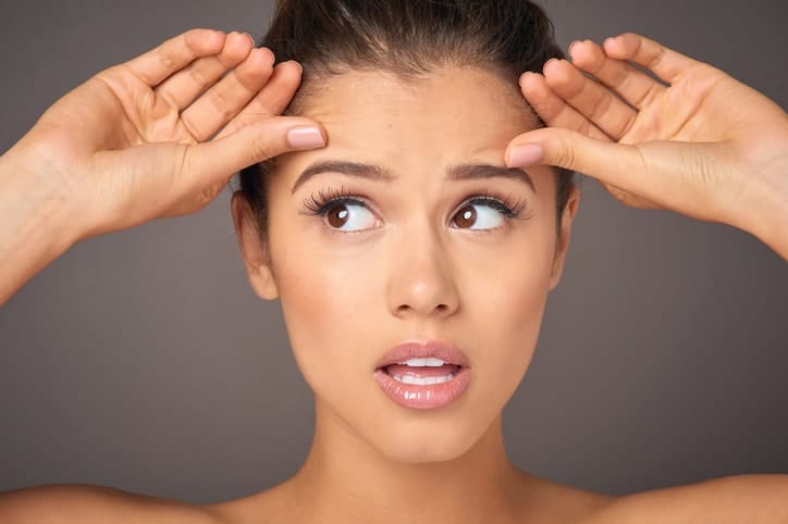 Before and after brow lift by Dr. Ali Soueid, showing elevated eyebrows and smoother forehead for a more open, youthful eye area.