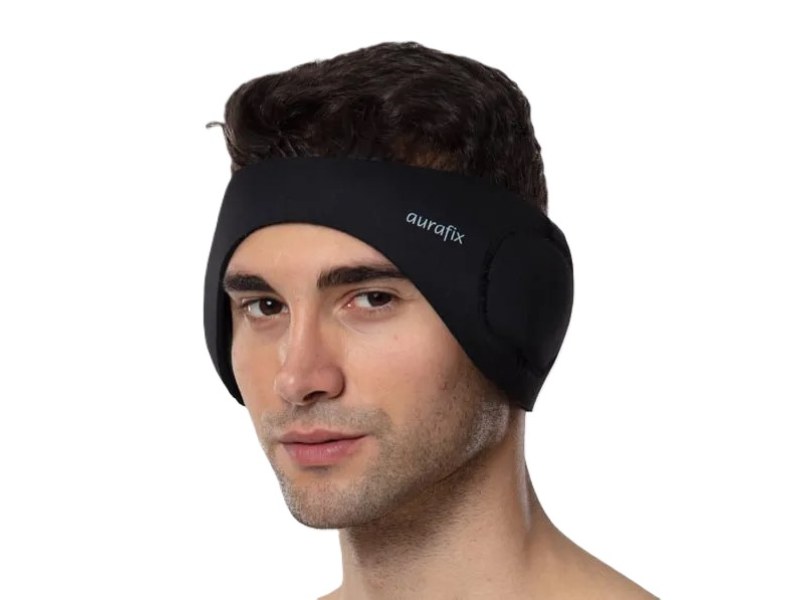 Patient wearing a soft supportive headband after pinnaplasty surgery